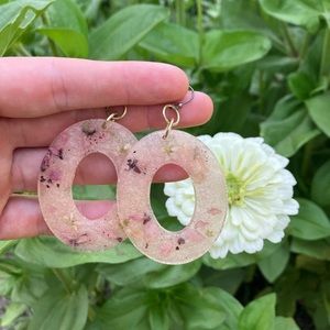 Handmade pink floral resin earrings.